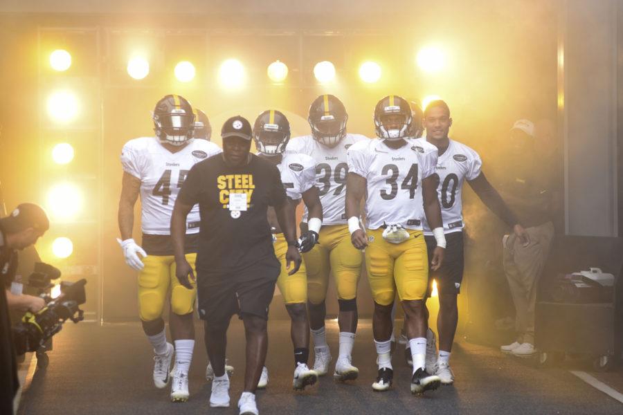 Steelers players walk onto the field during a practice in August. (Photo by Matt Hawley | Staff Photographer)