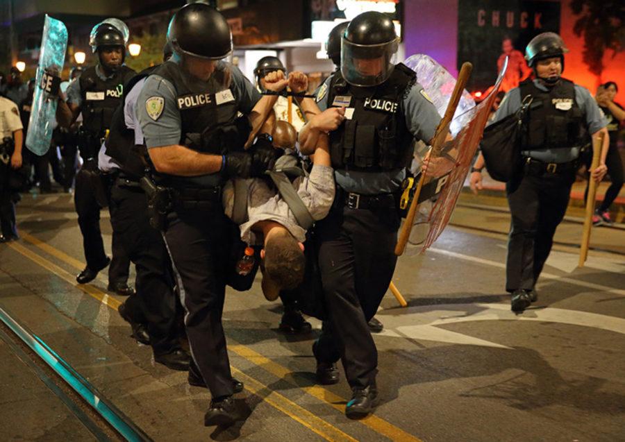 Police officers arrest a man during a confrontational protest on Delmar Boulevard in University City on Sept. 16, 2017. (David Carson/St. Louis Post-Dispatch/TNS)