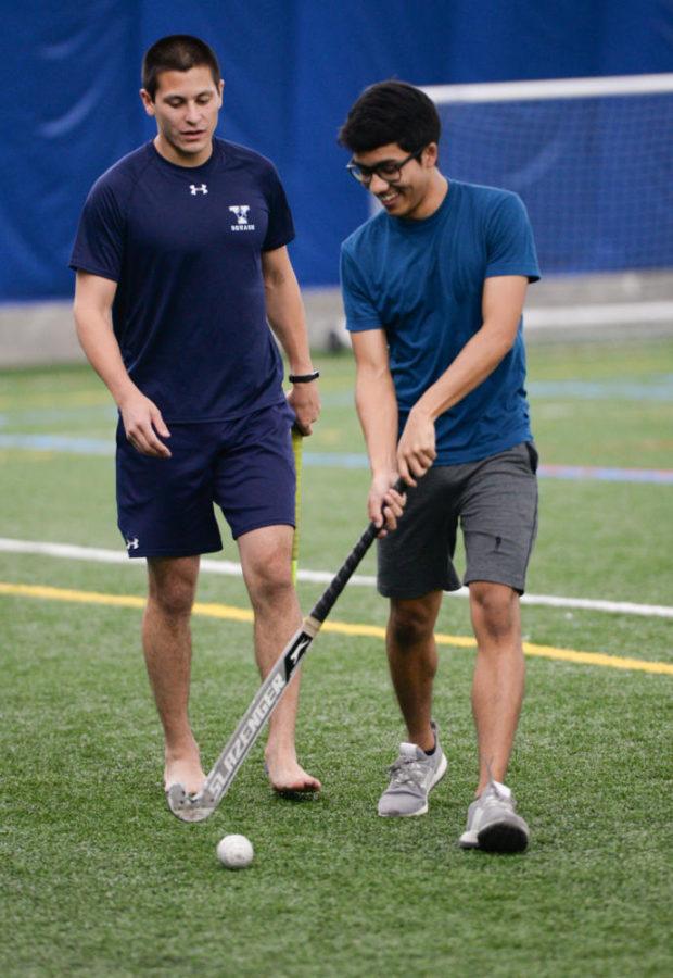 Brett Andrews (left) and Nikhil Khongbantabam practice at the Pitt Sports Dome on Monday evening.  (Photo by Sarah Cutshall | Staff Photographer)
