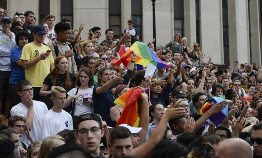 Students hold pride flags and chant at protesters across from Towers. (Photo by Wenhao Wu | Assistant Visual Editor)