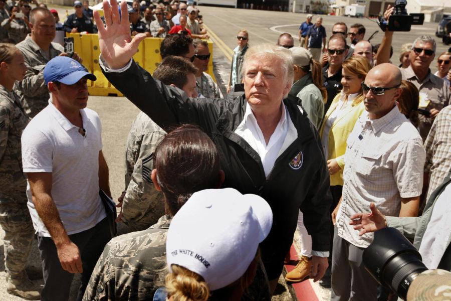 President Donald Trump and first lady Melania Trump arrive at Muniz Air National Guard Base in Carolina, Puerto Rico, on Oct. 3. (Carolyn Cole/Los Angeles Times/TNS)
