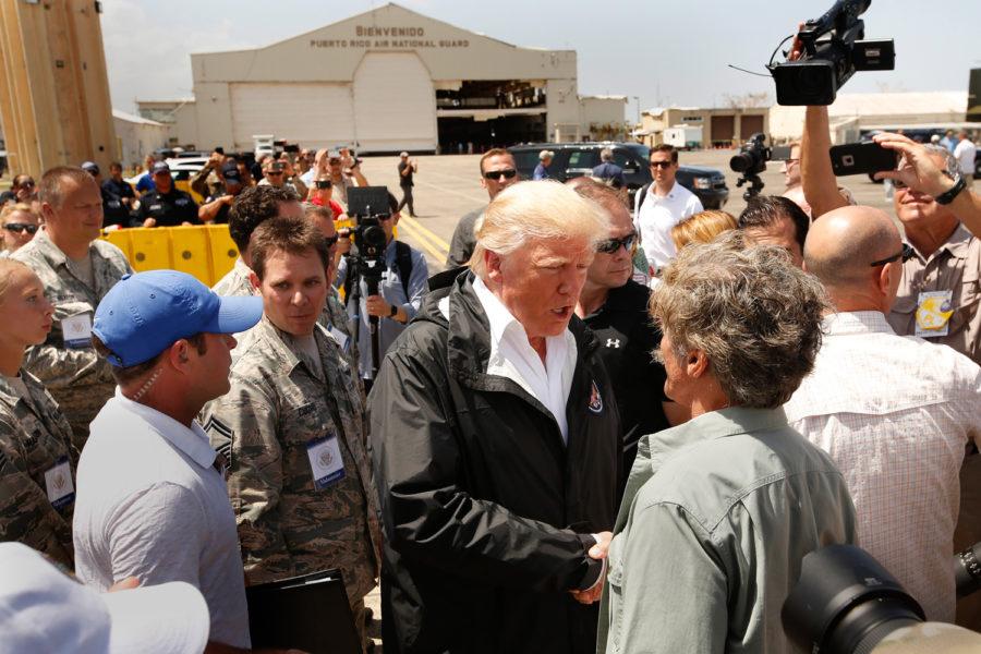 President Donald Trump and the First Lady Melania arrive at Muniz Air National Guard Base in Carolina, Puerto Rico on Oct. 3, 2017, almost two weeks after hurricane Maria hit the island. They met with residents there to greet the President. (Carolyn Cole/Los Angeles Times/TNS)