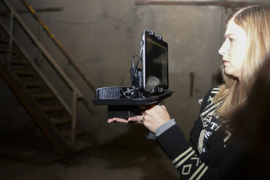 Katie Porfeli, a member of Ghosts N’at, uses a special camera that the hunters say senses paranormal activity.
(Photo by Elise Lavallee | Contributing Editor)