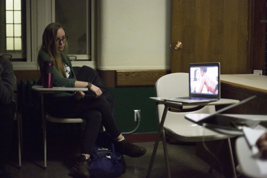 Students watch a clip of “Hot Girls Wanted,” a documentary which exposes corruption within the amateur porn industry, during AAUW’s “Let’s Talk About Sex: Pornography & Feminism” event Monday night. (Photo by Thomas Yang | Senior Staff Photographer)