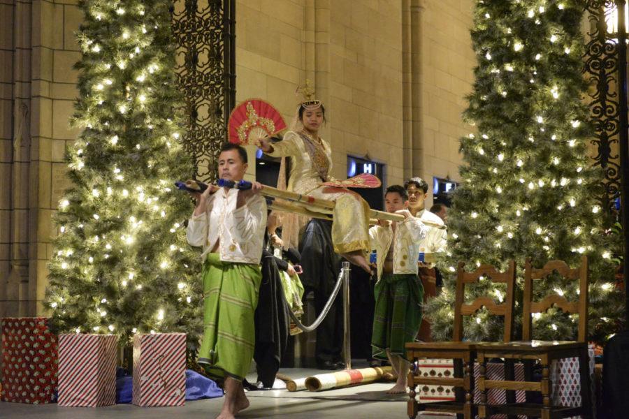 The Filipino American Association of Pittsburgh performs a traditional Filipino dance in the Cathedral of Learning during the Nationality Rooms Holiday Open House Sunday afternoon. (Photo by Elise Lavallee | Contributing Editor)