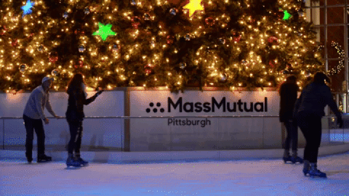 Skaters pass in front of the Christmas tree at the MassMutual Pittsburgh Ice Rink at PPG Place Downtown. (Photo by Christian Snyder | Contributing Editor)