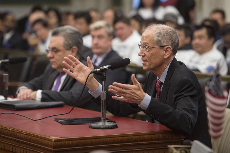 Thomas Farley, MD, health commissioner for the city of Philadelphia, responds to a question from a member of City Council’s Committee on Public Health and Human Services during a hearing on a bill that would prohibit beer deli owners from having protective safety glass separating them from their customers during a hearing Dec. 4, 2017. Farley and Dave Perri (left), head of Philadelphia’s Department of Licenses and Inspections, support the bill. (Clem Murray/Philadelphia Inquirer/TNS)
