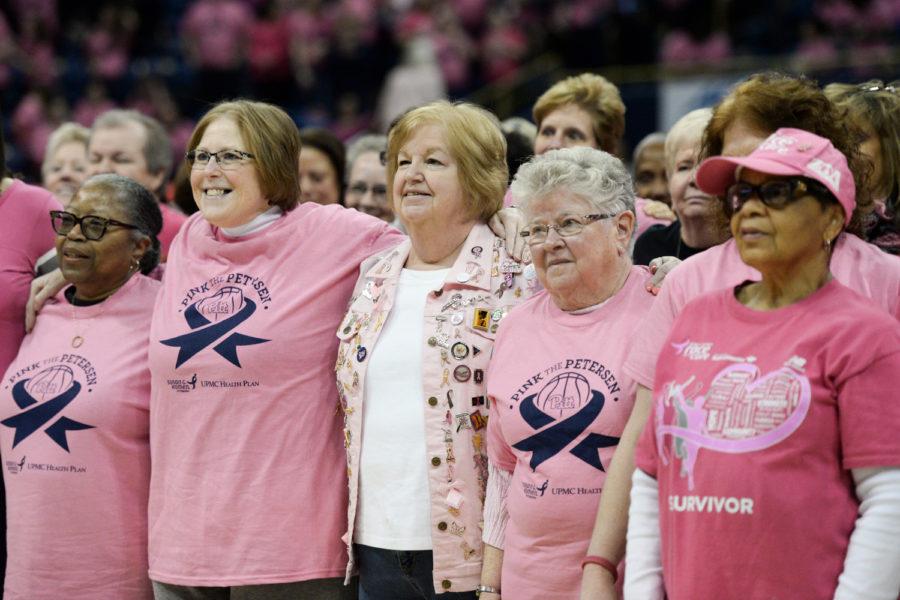 Breast cancer survivors stand together at 2017’s Pink the Pete game. (Photo by Anna Bongardino | Senior Staff Photographer)