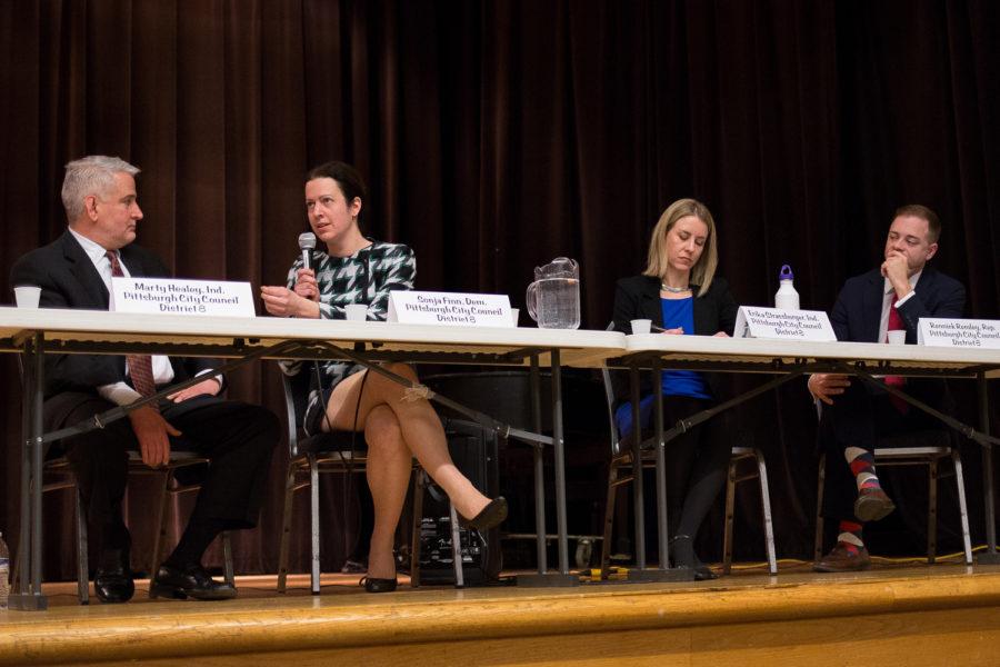 District 8 candidates Marty Healey (far left), Erika Strassburger (right) and Rennick Remley (far right) listen as Democratic candidate Sonja Finn(left) gives her stance on gun violence at Thursday evening’s District 8 Special Election Candidates Town Hall. (Photo by Thomas Yang | Visual Editor)