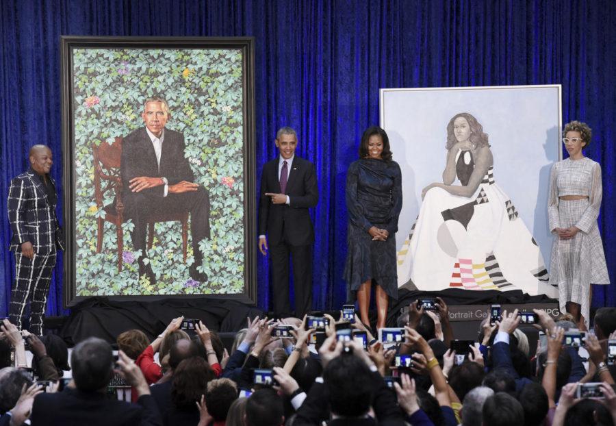 Former First Lady Michelle Obama and former President Barack Obama pose with artists Kehinde Wiley and Amy Sherald during the unveiling of their official portraits at the National Portrait Gallery Monday in Washington, D.C. (Olivier Douliery/Abaca Press/TNS)