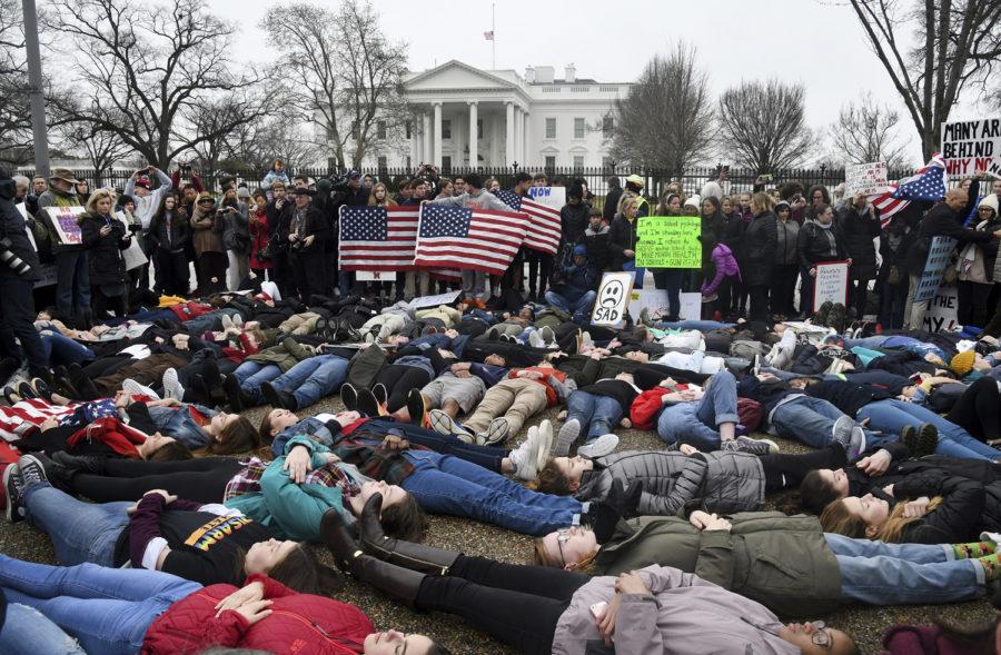 Students+take+part+in+a+lie-in+on+the+road+outside+of+the+White+House+Monday%2C+February+19%2C+2018+in+Washington%2C+D.C.%2C+for+three+minutes+at+a+time+in+an+effort+to+symbolize+the+short+amount+of+time+it+took+alleged+shooter+Nikolas+Cruz+to+gun+down+numerous+people+at+Marjory+Stoneman+Douglas+High+School+in+Parkland%2C+Florida%2C+last+week.+%28Olivier+Douliery%2FAbaca+Press%2FTNS%29