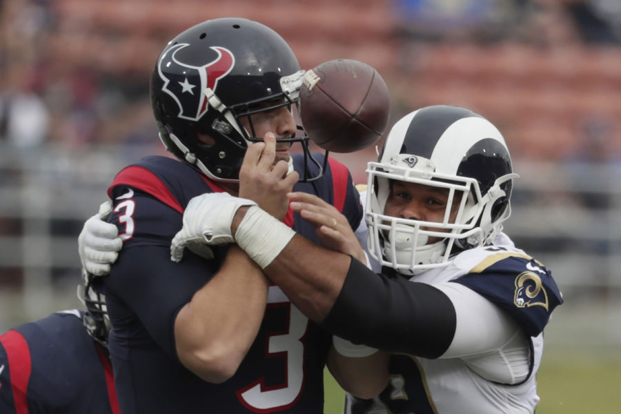 Rams defensive lineman Aaron Donald knocks the ball from Texans quarterback Tom Savage for a fumble early in the first quarter Nov. 12, 2017, at the Coliseum in Los Angeles. (Robert Gauthier/Los Angeles Times/TNS)