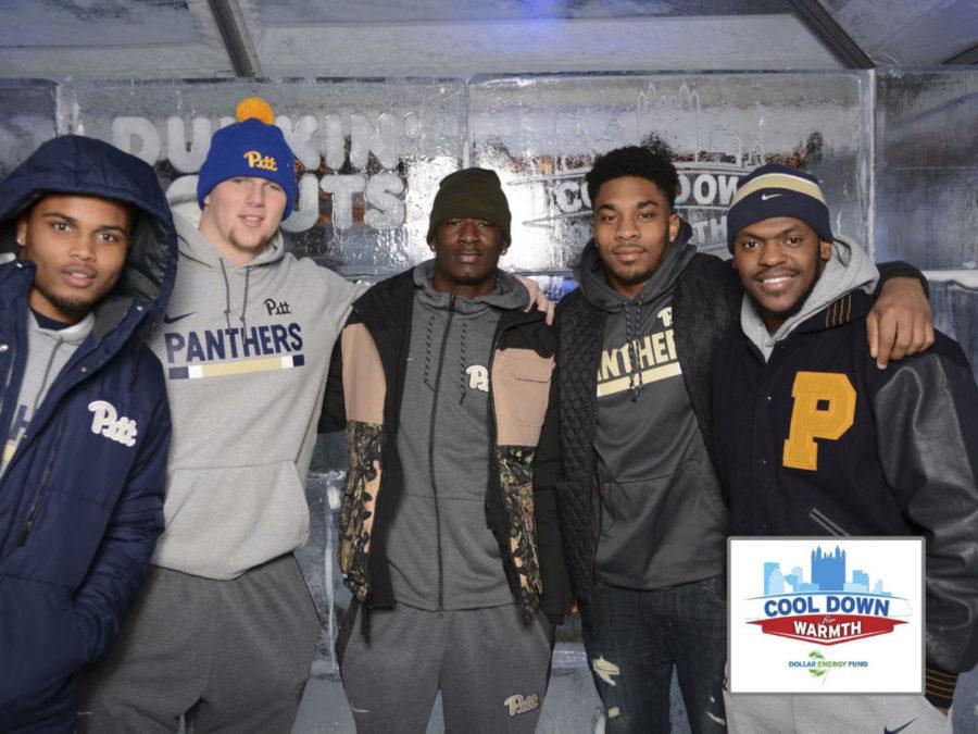 Shocky Jacques-Louis (middle) stands alongside fellow Pitt football recruits and Celeste Welsh, the Pitt Athletics media relations coordinator, at the Cool 
Down for Warmth fundraiser Jan. 25. (Photo courtesy of Jake Kradel)
