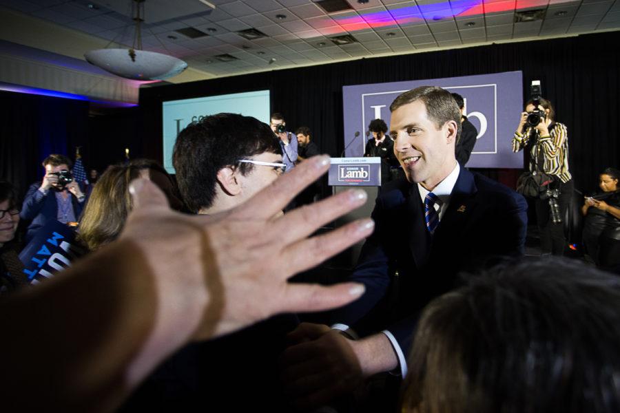 Conor Lamb shakes hands with supporters after declaring victory in Tuesdays special election, confident in his lead even as a few thousand absentee ballots remained uncounted. (Photo by John Hamilton / Managing Editor)