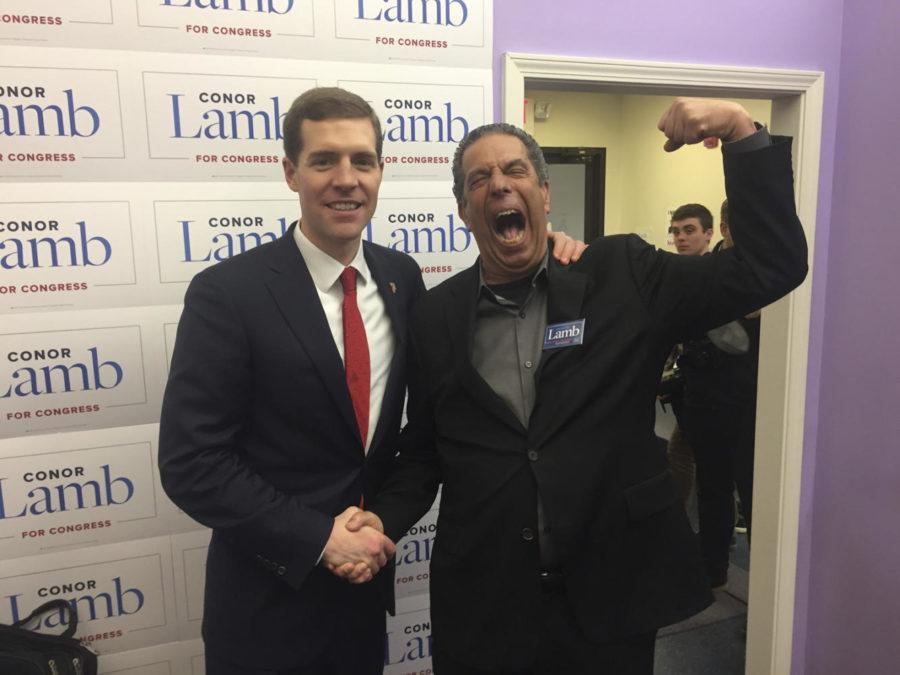 Democratic Congressional candidate Conor Lamb, left, and Jon Bowzer Bauman of the musical group Sha Na Na in Lambs campaign office. (Evan Halper / Los Angeles Times/TNS)