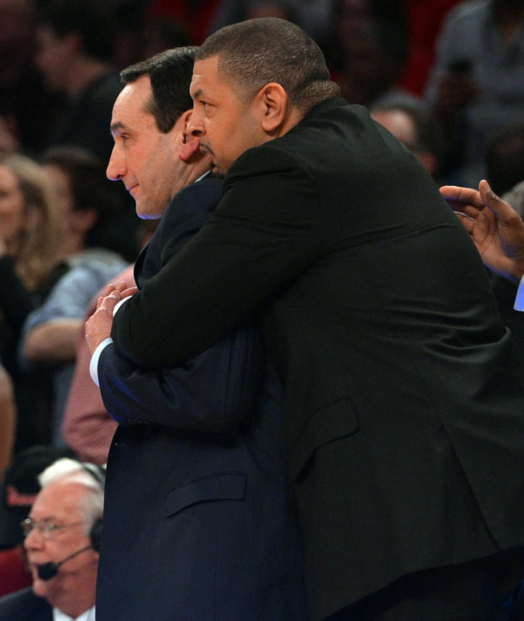 Duke head coach Mike Krzyzewski is hugged by assistant coach Jeff Capel as Krzyzewski won his 1,000th career game. (Chuck Liddy/Raleigh News & Observer/TNS)