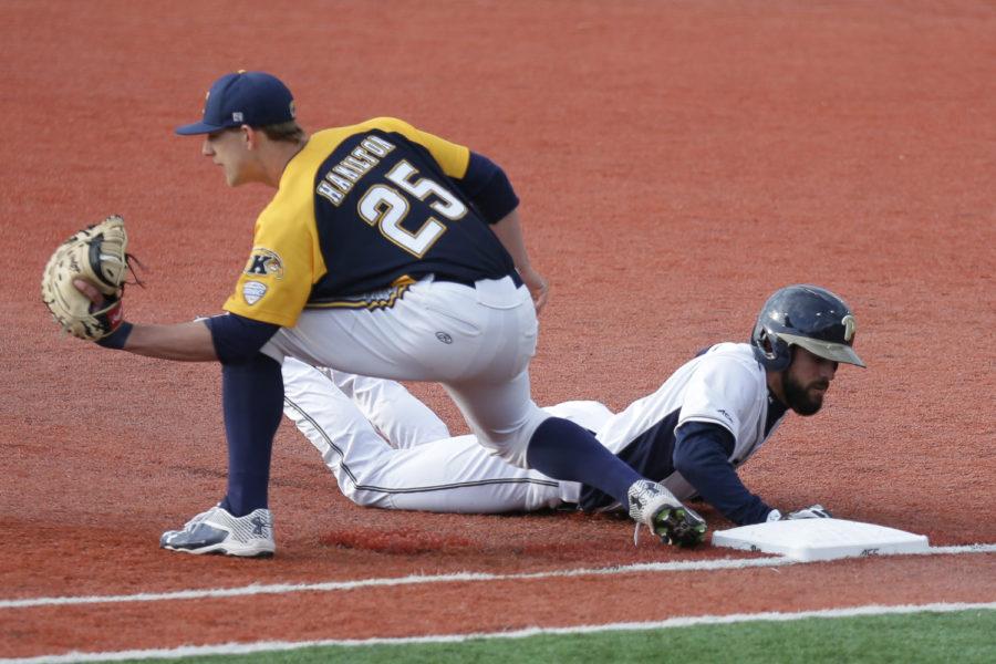 Redshirt senior Frank Maldonado slides into first base after attempting to steal second at Pitt’s 4-1 loss to Kent State Tuesday evening. (Photo by Thomas Yang | Visual Editor)
