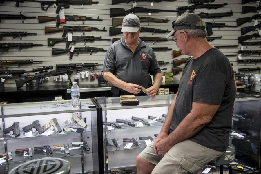 Mike Fiorille, business partner at Get Loaded, serves a customer at the gun store on June 30, 2016, in Grand Terrace, Calif. (Gina Ferazzi/Los Angeles Times/TNS)
