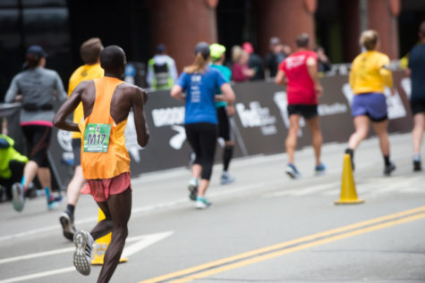 Cyrus Korir, the first place finisher of the elite mens category of the 2018 Pittsburgh Half Marathon, had never run a half marathon in his life before Sunday. In the final stretch of the race, he outran second place finisher and defending champion Julius Kogo to take the victory. (Photo by Jane Millard | Visual Editor) 