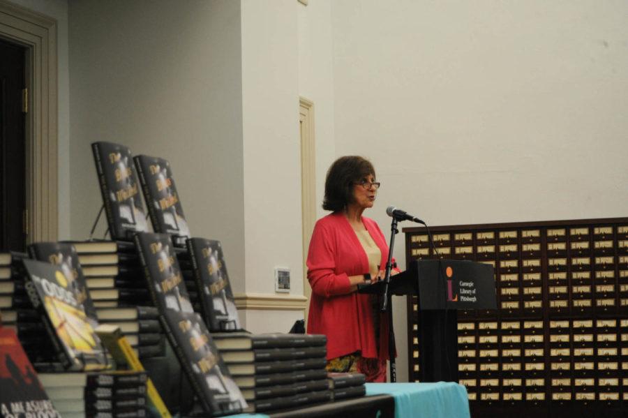 Kathleen George, a tenured Theatre Arts professor at Pitt, spoke at Carnegie Library for the launch of her latest historical fiction novel, “The Blues Walked In.” (Photo by Anne Amundson | Staff Photographer)