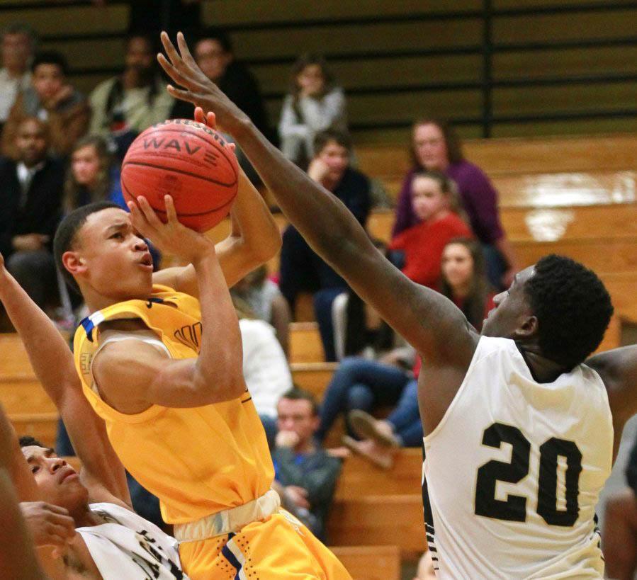 McGowens+takes+a+fadeaway+shot+in+his+Hargrave+Military+Academy+uniform.+%28Photo+courtesy+of+Bobby+McGowens%29
