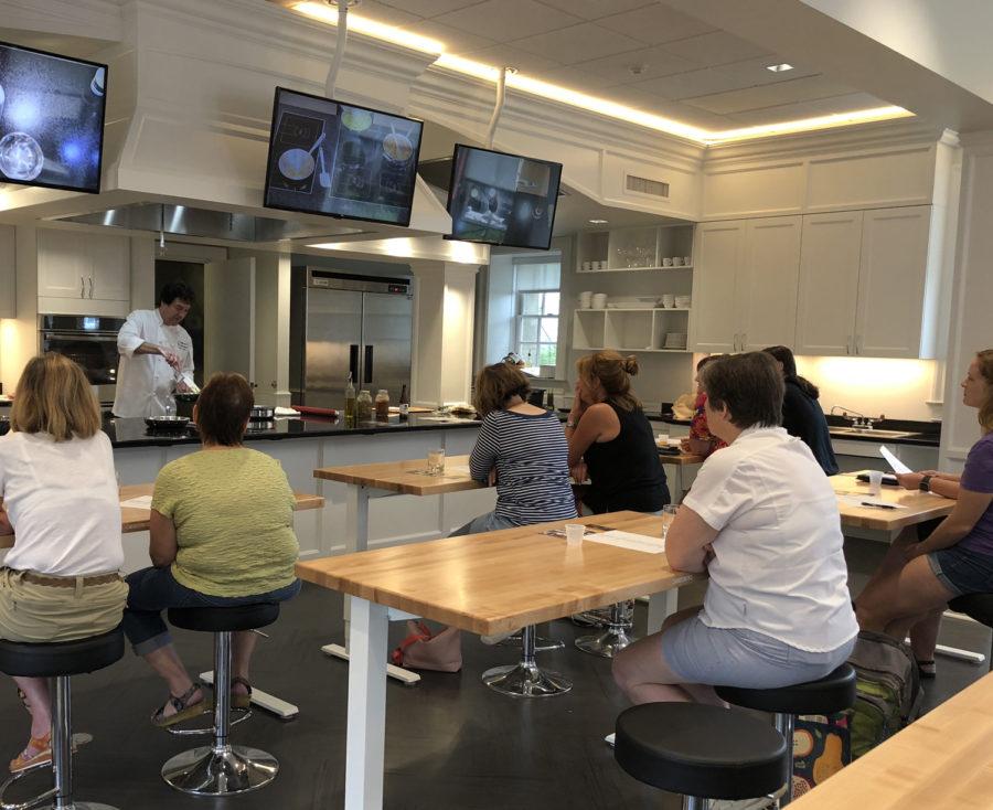 Chef Kaufmann teaches a tomato and garlic-themed cooking class in Phipps Conservatory Sunday evening. (Photo by Sam Weber | Contributing Writer)