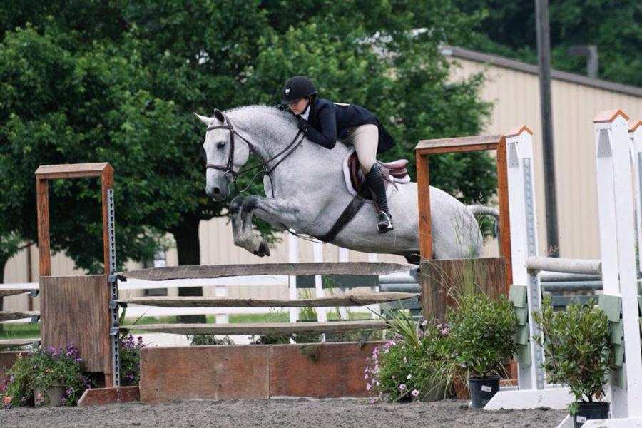 Sophomore biology major Haley Maher competes at State College with her horse Perry. 