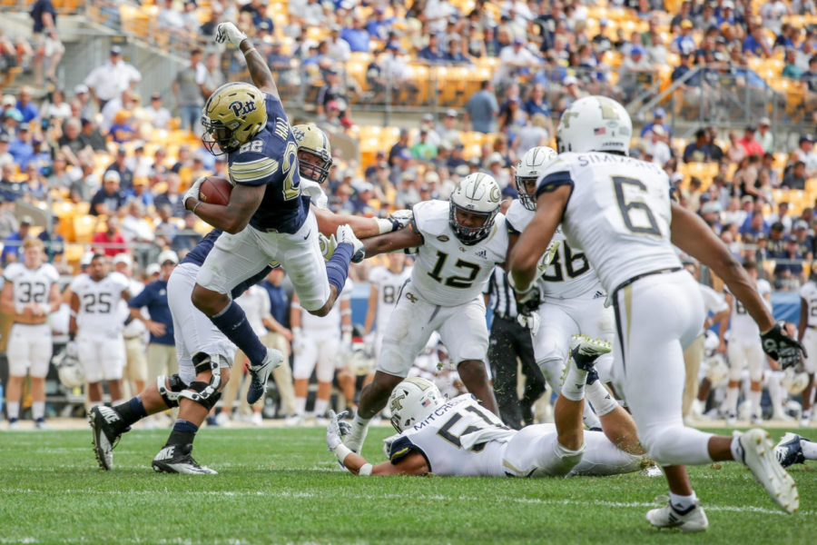Senior running back Darrin Hall (22) leaps over Georgia Tech senior linebacker Brant Mitchell (51) while carrying the ball. The Panthers have lost two straight games since that win.