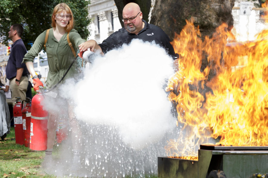 Pitt’s Department of Environmental Health and Safety demonstrates proper fire extinguisher handling at SGB’s Fall Safety Fair Tuesday afternoon. (Photo by Anas Dighriri | Staff Photographer)
