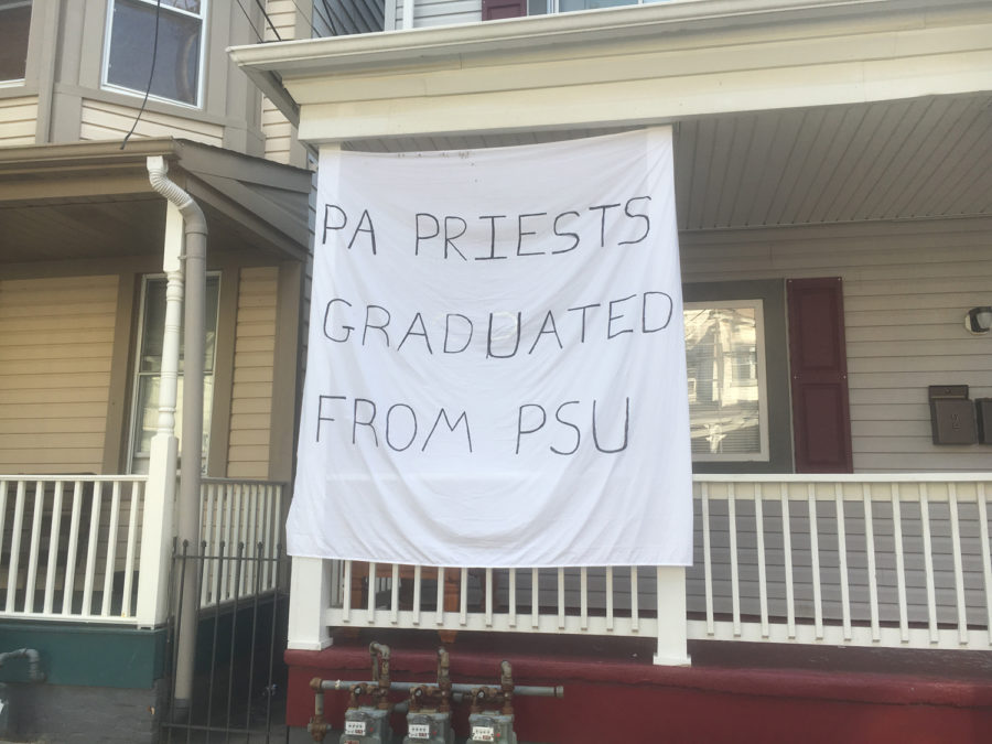 Residents on Atwood Street hung a sign that draws a reference between Penn State’s sex abuse scandal with Jerry Sandusky and the more recent sex abuse scandal with the Catholic Dioceses in Pennsylvania.