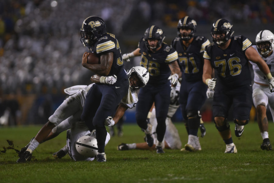 Redshirt senior running back Qadree Ollison (30) completed Pitt’s only successful touchdown at the Panther’s 51-6 loss to Penn State Saturday evening. (Photo by Anna Bongardino | Visual Editor)
