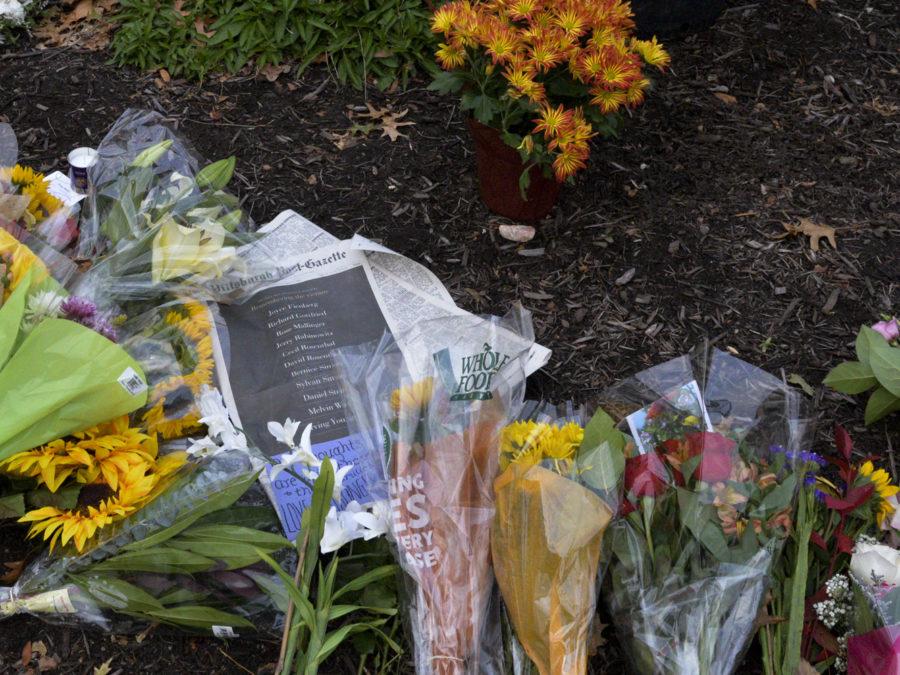 Mourners placed flowers, notes and the front page of the Pittsburgh Post-Gazette, which lists each victim’s name outside Tree of Life Synagogue.