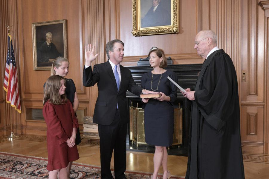 Retired Justice Anthony M. Kennedy, administers the Judicial Oath to Judge Brett M. Kavanaugh in the Justices Conference Room at the Supreme Court Building on Saturday in Washington, DC.