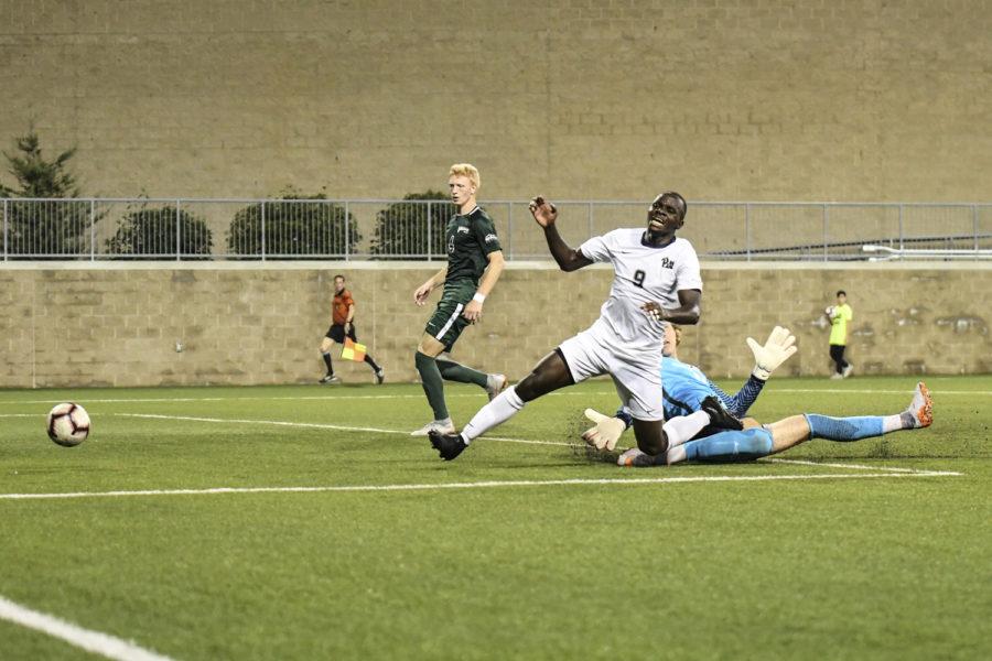 Sophomore forward Edward Kizza takes a shot on goal during Pitt’s 3-4 loss to Cleveland State Monday night.