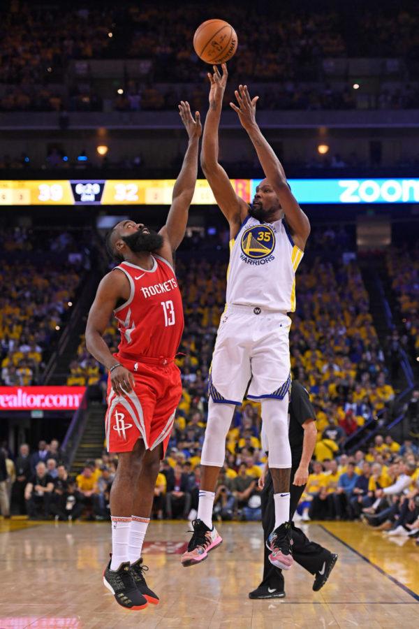 Golden State Warriors’ Kevin Durant (35) shoots over Houston Rockets’ James Harden (13) during the second quarter of Game 3 of the NBA Western Conference finals on May 20 at Oracle Arena in Oakland, Calif. (Jose Carlos Fajardo/Bay Area News Group/TNS)
