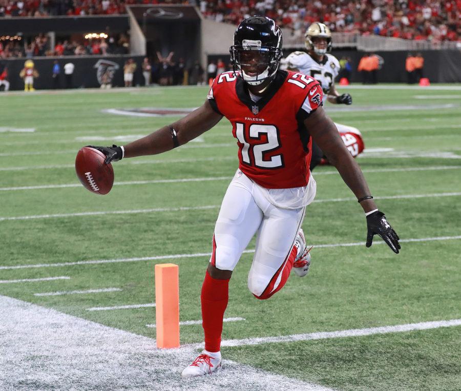 Atlanta Falcons wide receiver Mohamed Sanu scores a touchdown for a 35-30 lead over the New Orleans Saints during the fourth quarter Sunday in Atlanta. 