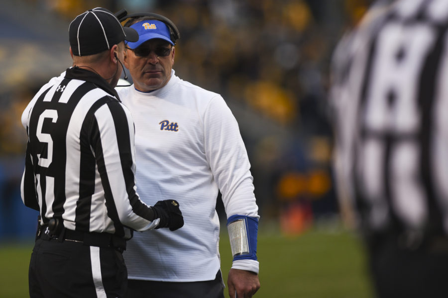 Head coach Pat Narduzzi speaks with a referee during Pitt’s last home game earlier this month.