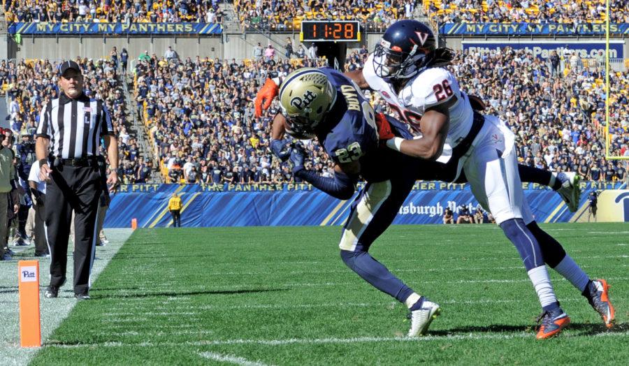 Pitts then-wide receiver Tyler Boyd pulls in a pass for an 8-yard touchdown as hes defended by Virginias Maurice Canady in the third quarter on Oct. 10, 2015, at Heinz Field. Pitt won, 26-19. 