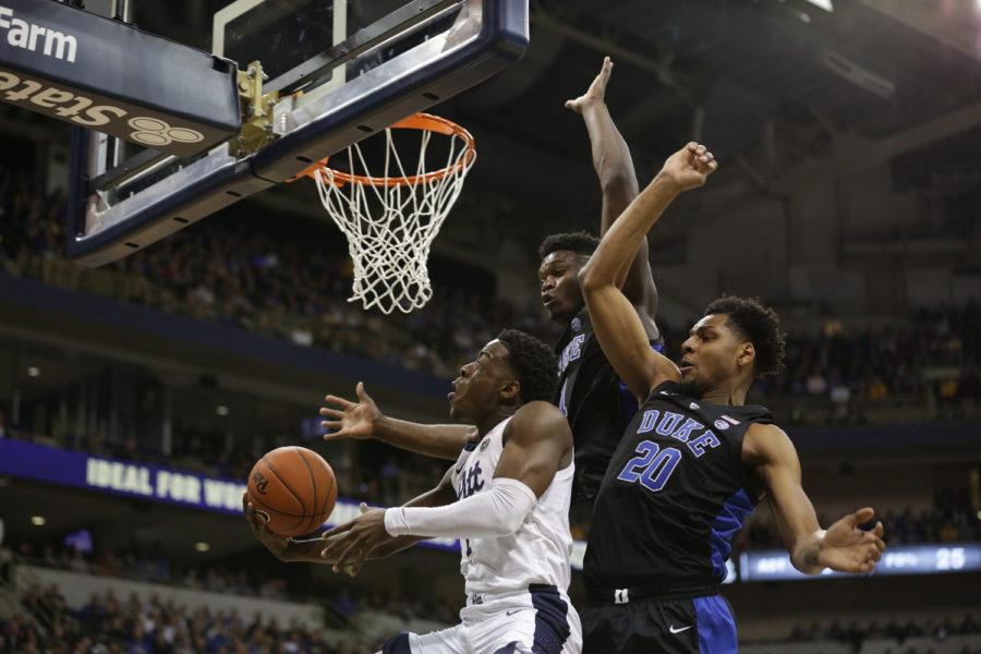 First-year guard Xavier Johnson (1), pictured here vs. Duke, was held to single-digit points for the second straight game against Louisville.