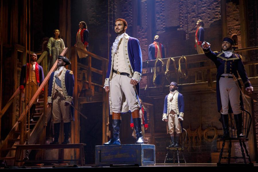 Actor Austin Scott (center) takes the titular role of Alexander Hamilton in the musical Hamilton.