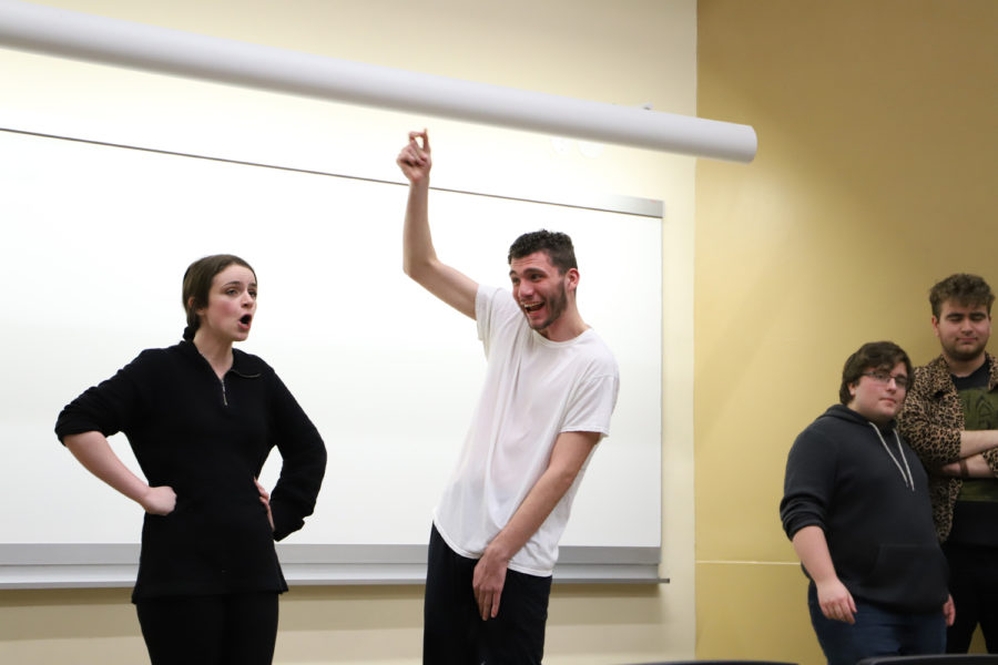 Two Ruckus members, sophomores Clare Donaher and Patrick Meyer, perform their routine that revolves around rotating troupe members in and out in the middle of skits.