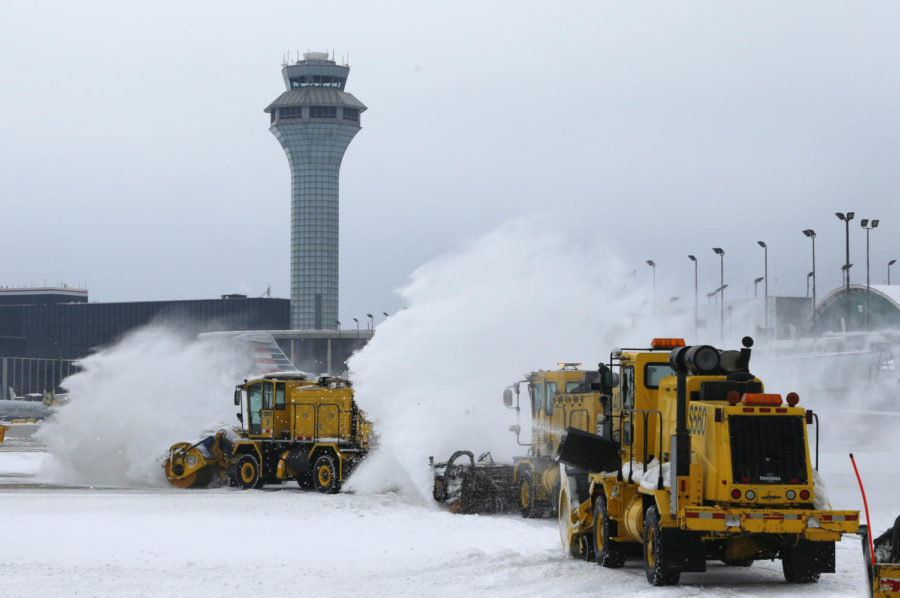 Snowplows clear snow along runways and the tarmac at Chicago OHare International Airport on Monday, Jan. 28, 2019 in Chicago.  More snow is expected today and temperatures are expected to drop this week.