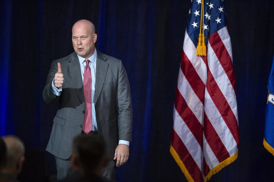 Acting U.S. Attorney General Matthew Whitaker responds to the audience after speaking on Thursday, Dec. 6, 2018, to the Project Safe Neighborhoods national conference at The Westin Crown Center hotel in Kansas City, Mo. 