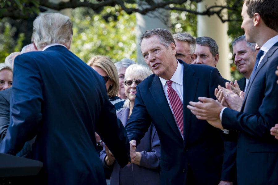 President Donald J. Trump congratulates U.S. Trade Representative Robert Lighthizer as he delivers remarks on the United States Mexico Canada Agreement (USMCA) in the Rose Garden at the White House on Monday, Oct. 1, 2018 in Washington, D.C. President Trump announced the United States and Canada have agreed to a deal replacing the North American Free Trade Agreement. (Pete Marovich/Abaca Press/TNS)
