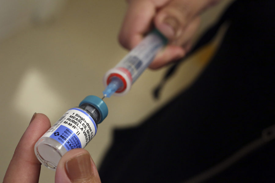 A vial containing the MMR vaccine is loaded into a syringe before being given to a baby at the Medical Arts Pediatric Med Group in Los Angeles on Feb. 6, 2015. 