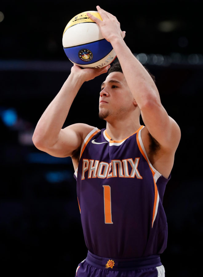 Phoenix Suns guard Devin Booker puts up a shot during the 3-point shooting contest at the 2018 NBA All-Star Game at Staples Center in Los Angeles on Feb. 18, 2018. 
