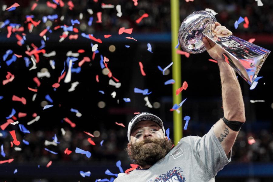 Super Bowl MVP Julian Edelman hoists the Lombardi Trophy after the New England Patriots beat the Los Angeles Rams, 13-3, in Super Bowl LIII at Mercedes-Benz Stadium in Atlanta on Sunday. 
