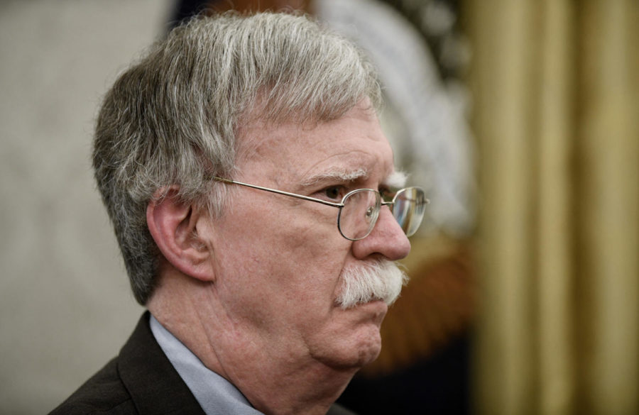 National security adviser John Bolton listen to U.S. President Donald Trump about the new directive centralizing all military space functions under a new Space Force, which will be overseen by the Department of the Air Force, in the Oval Office of the White House on Tuesday, February 19, 2019, in Washington, D.C. 