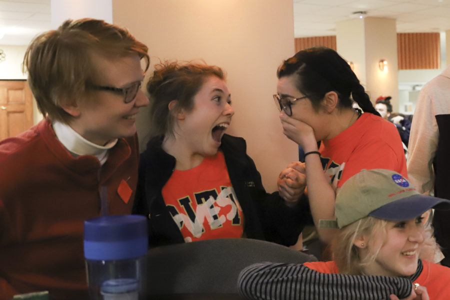 Anaïs Peterson (top right) and members of Fossil Free Pitt react to hearing that Peterson won the runoff election for SGB executive vice president. 

