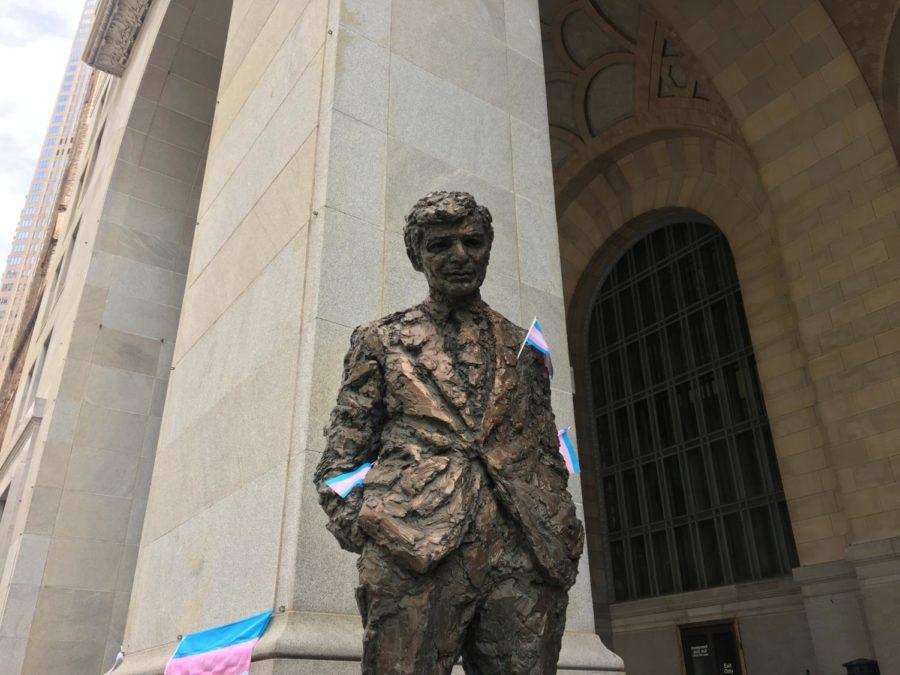 Transgender rights activists placed transgender pride flags on a statue of former Pittsburgh mayor Richard Caliguiri.